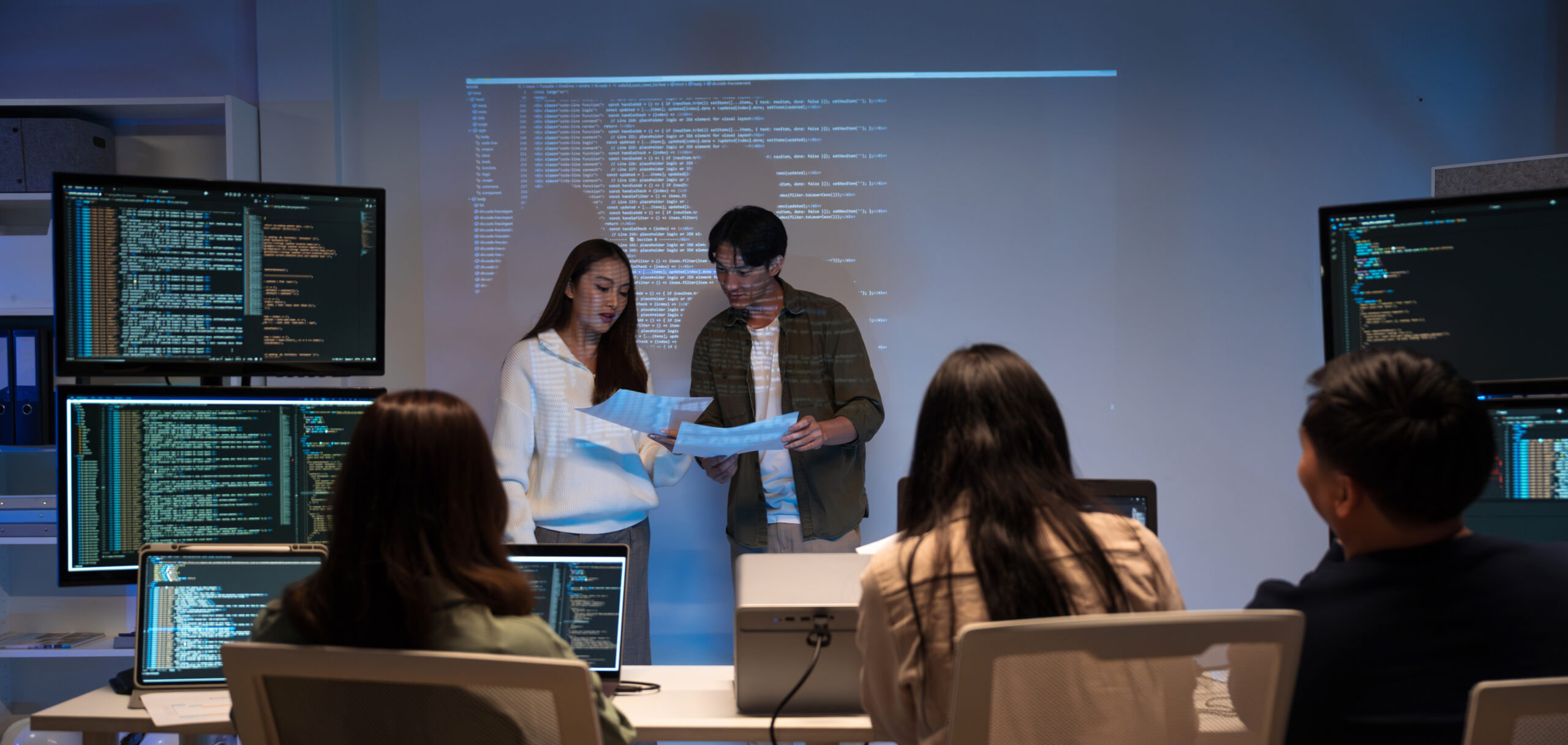 Asian man presenting code with projector in softwa 2026 01 05 00 09 48 utc scaled