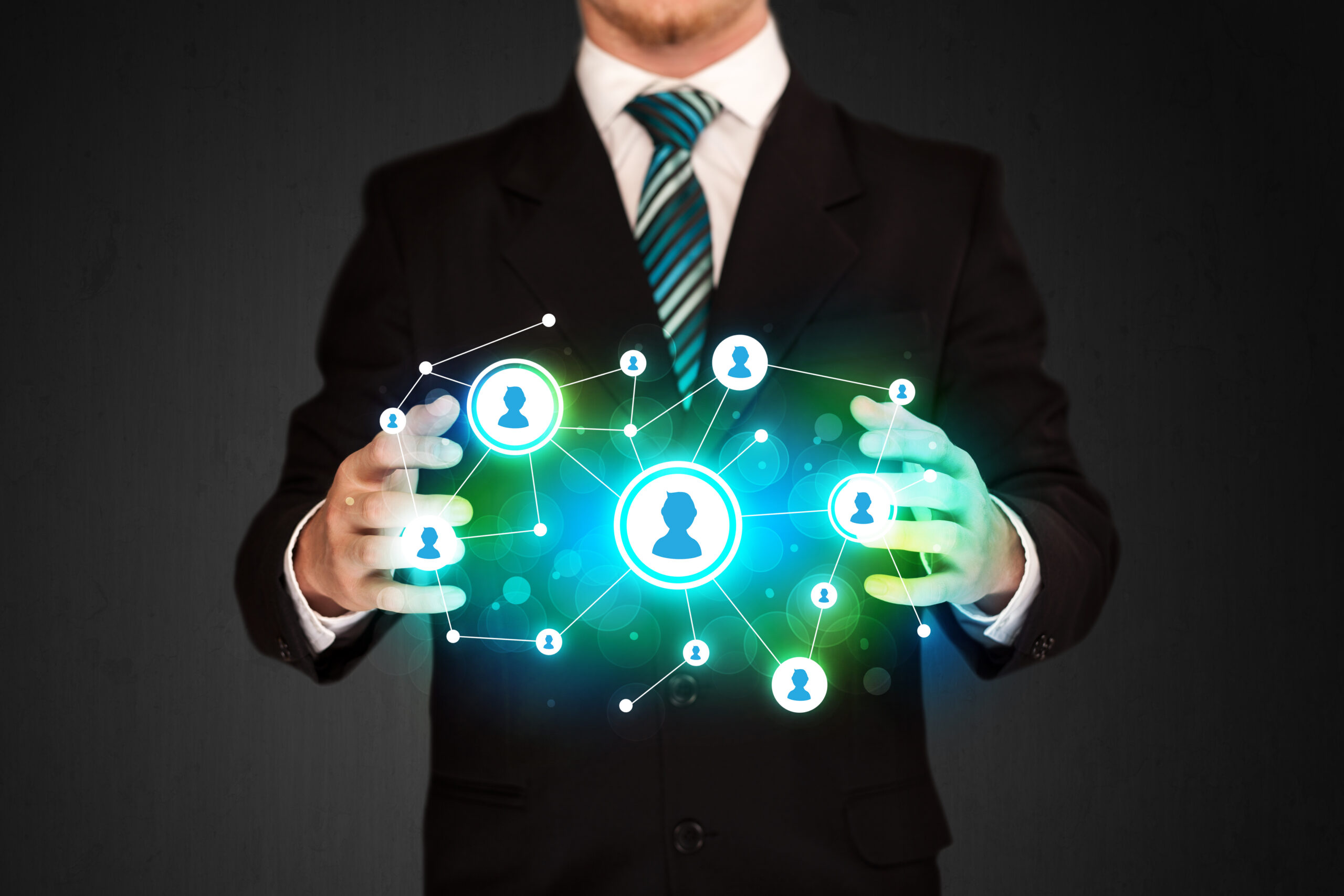 Businessman holding social media network icons str 2026 01 09 14 47 17 utc scaled