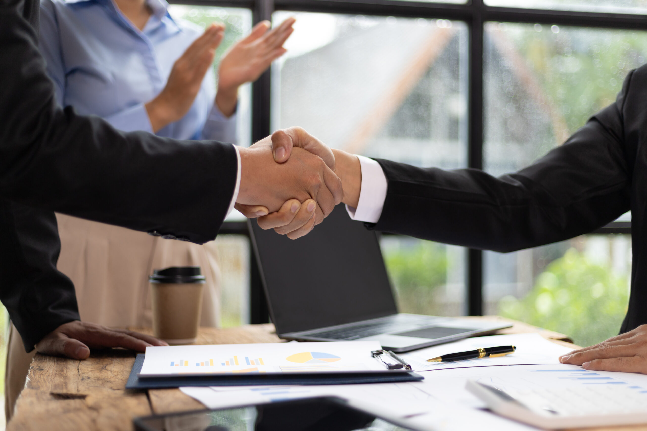 Businessmen shaking hands at a meeting of business 2026 01 09 10 49 46 utc scaled